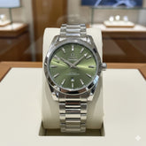 OMEG A GREEN DIAL QUARTZ METAL STRAP WATCH